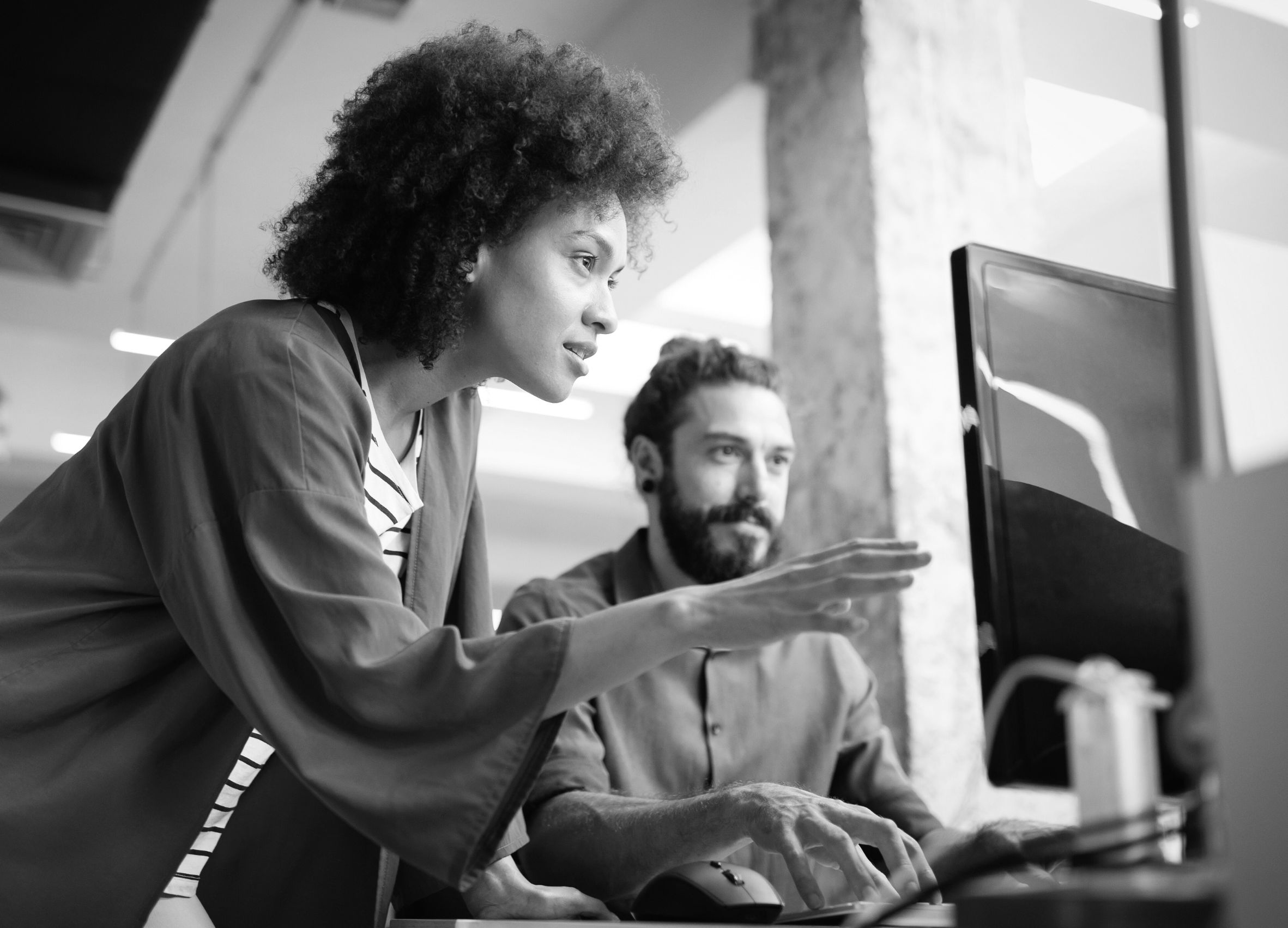 people looking at a computer