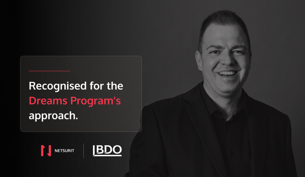 Greyscale image of a man smiling with a text on the image saying: Recognised for the Dream's Program approach.